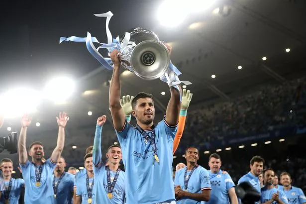 Rodri lifts the Champions League trophy
