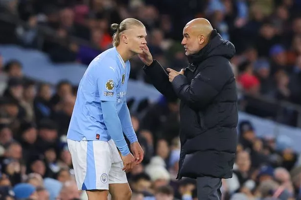 Erling Haaland and Pep Guardiola chat
